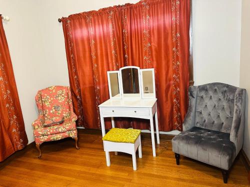 a room with a desk and a chair and a mirror at Cozy Allentown Home in Buffalo