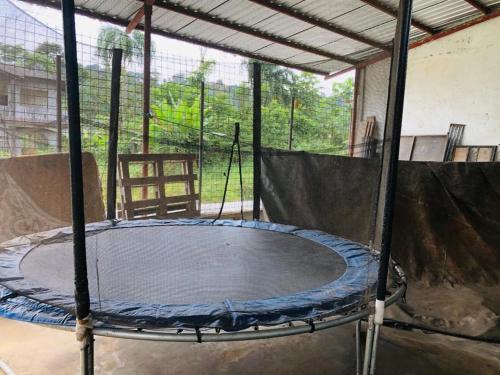 a large trampoline in a room with a table at Zumag Sisa in Tena