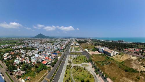 an aerial view of a city with buildings and the ocean at Apec Mandala Phú Yên - Luxury Codotel in Phước Hậu