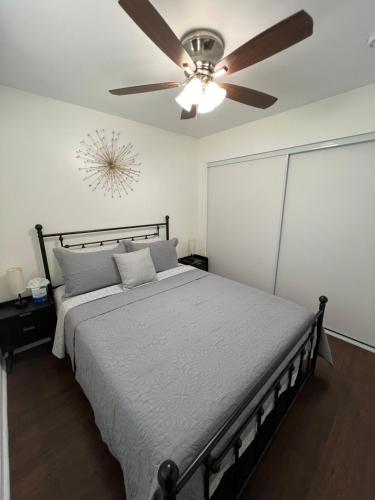 a bedroom with a bed with a ceiling fan at Mini-Home in Whittier in Whittier