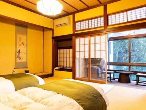Cama o camas de una habitación en 明石家