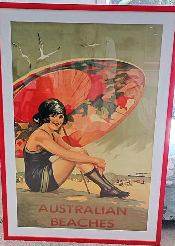 a framed picture of a woman with a surfboard at River View - Modern Living in a Vintage Apartment in Brunswick Heads
