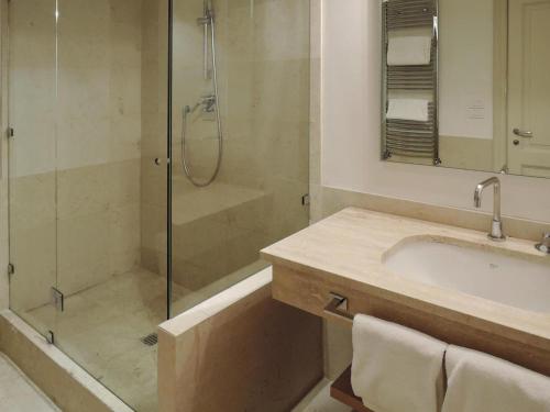 a bathroom with a shower and a sink and a tub at Residence Villa Il Palagio, Rignano sull" Arno in Rignano sullʼArno