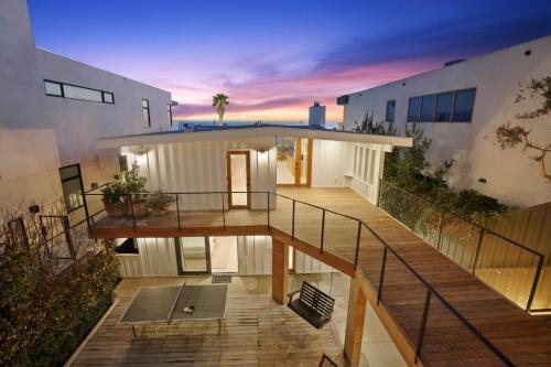 a view of a house with a deck at dusk at The Surf Lodge Villa in Malibu