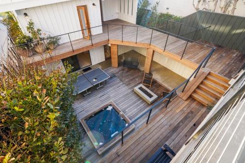 an overhead view of a deck with a swimming pool at The Surf Lodge Villa in Malibu