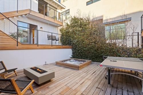 a patio with a table and a fire pit at The Surf Lodge Villa in Malibu