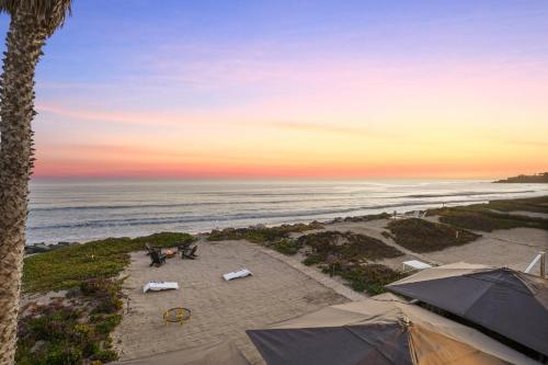 an aerial view of a beach with tents and the ocean at The Surf Lodge Villa in Malibu