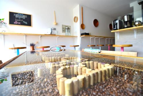 a display of wine bottles on a glass table at Hotel Biscuit in Cluj-Napoca