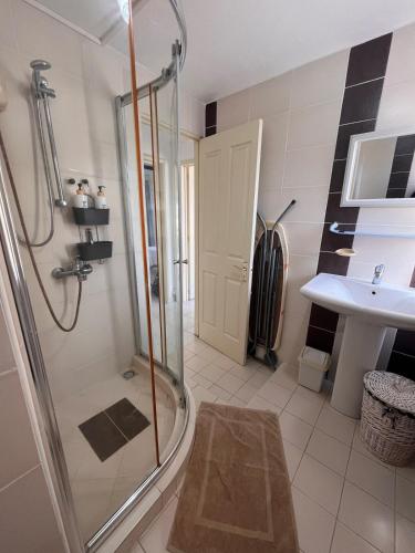 a bathroom with a shower and a sink at Baobab 3 Apartment in Grand-Baie