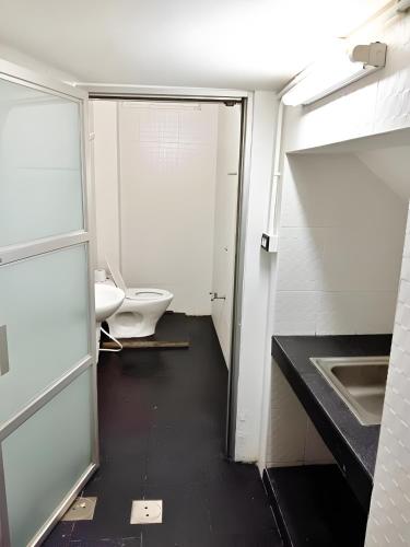 an empty bathroom with a sink and a toilet at The Character Yaowarat MRT วัดมังกร in Bangkok