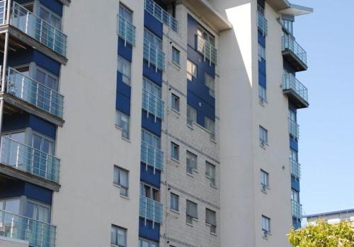 an apartment building with blue balconies on the side at Executive 3 Bed Apartment Aberdeen in Aberdeen