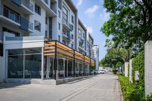 an empty street in front of a building at The Capital on Bath in Johannesburg