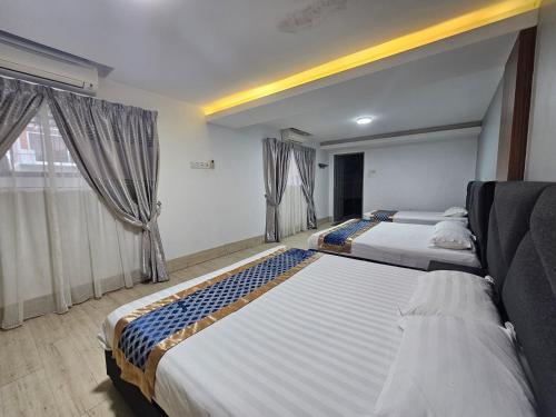 Ένα ή περισσότερα κρεβάτια σε δωμάτιο στο Melody Whole Or Suite Room