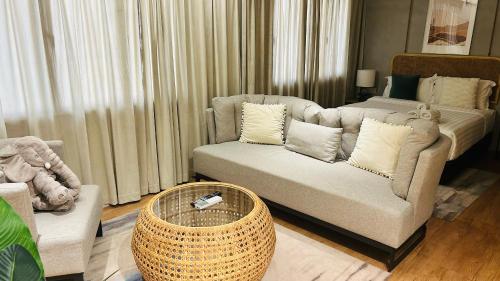 a living room with a couch and a coffee table at Urban Living Residence in Kuala Lumpur