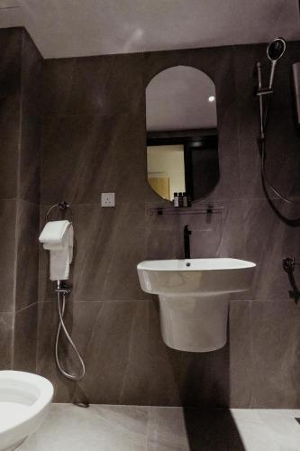 a bathroom with a sink and a mirror at Urban Living Residence in Kuala Lumpur