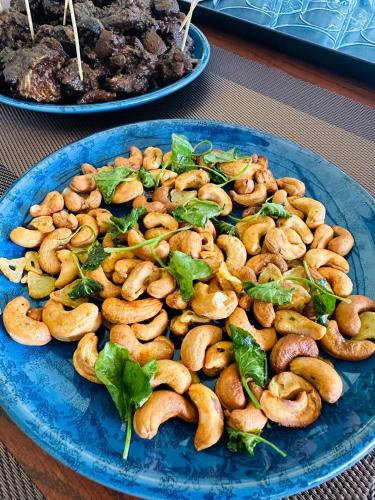 a blue plate of food on a table at Monticello Bungalow in Kotmale
