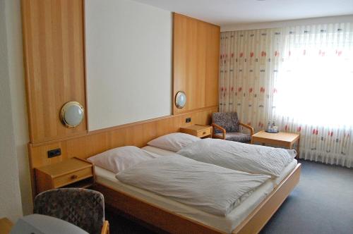 Postel nebo postele na pokoji v ubytování Hotel Hubertushof