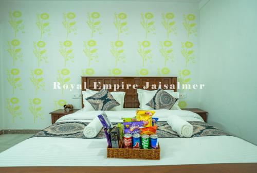 a bedroom with a bed with a basket on it at Royal Empire Camp & Resort Jaisalmer in Sām
