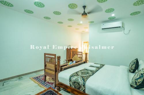 a bedroom with a bed and a ceiling at Royal Empire Camp & Resort Jaisalmer in Sām
