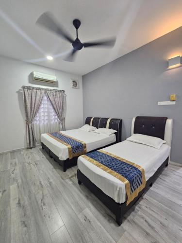 Ένα ή περισσότερα κρεβάτια σε δωμάτιο στο Melody Whole Or Suite Room