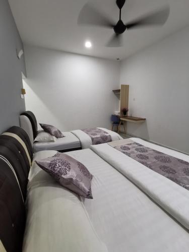 Ένα ή περισσότερα κρεβάτια σε δωμάτιο στο Melody Whole Or Suite Room