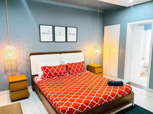 a bedroom with a bed and two pictures on the wall at Apartment P - 3 Bedrooms in Belas