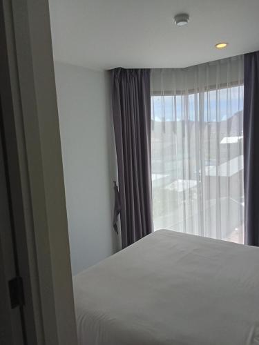 Ένα ή περισσότερα κρεβάτια σε δωμάτιο στο Modern Condo - 1BR T3-528