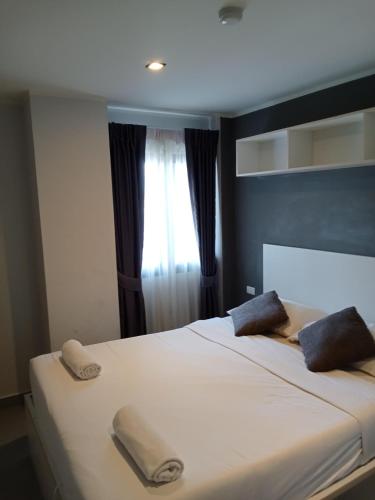 Ένα ή περισσότερα κρεβάτια σε δωμάτιο στο Well located condo-1BR T1-NV-203