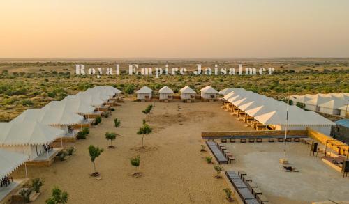 an aerial view of a resort with white umbrellas at Royal Empire Camp & Resort Jaisalmer in Sām