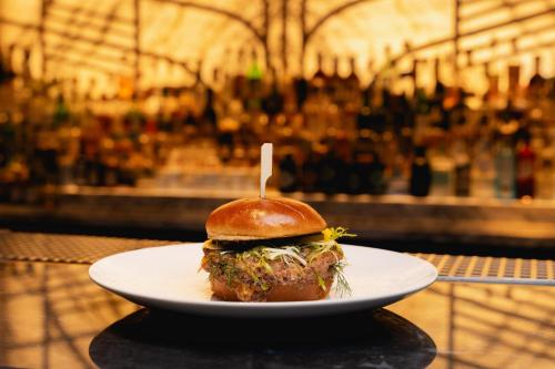 a sandwich on a plate on a table at The Ritz-Carlton, Berlin in Berlin
