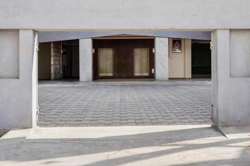 an empty parking lot with two columns in a building at Super Collection O OMR Perungudi in Chennai
