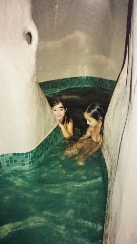 two women swimming in a pool of water at Al Jatib in Baza