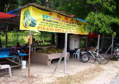 a food stand with a sign in front of it at La Ferringhi Villa - Balinese Collection, by ALV in Batu Ferringhi