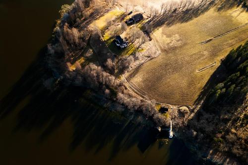 an aerial view of a field in the water at Stay North - Marjaniemi in Salo