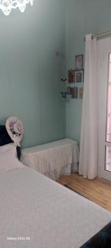 Postel nebo postele na pokoji v ubytování Βίλα Πασιθέα