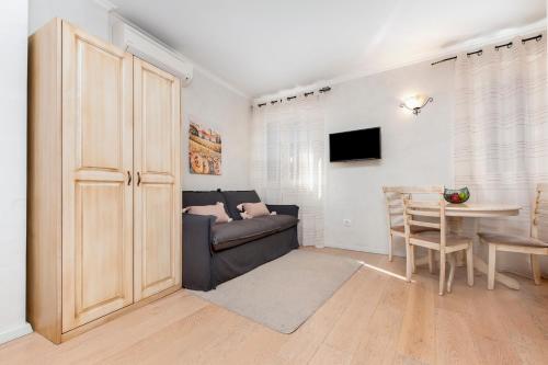 a living room with a couch and a table at Casa Matteotti in Rovinj