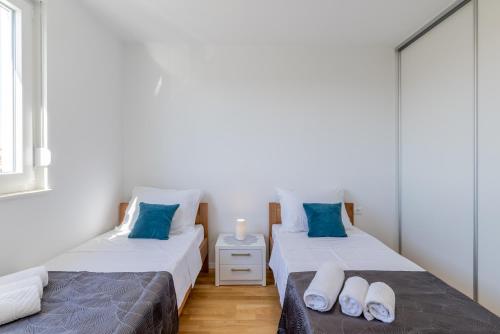 Postel nebo postele na pokoji v ubytování Apartment Solin Mezanovci