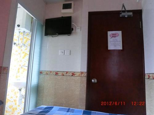 Televisyen dan/atau pusat hiburan di Dutch Hostel