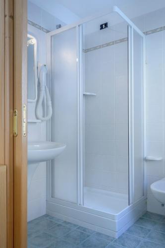 a bathroom with a shower and a sink at Hotel La Nuova Montanina in Auronzo di Cadore