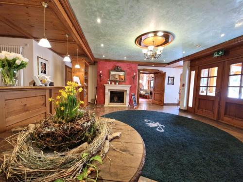a living room with a large room with a fireplace at Mosers Blume Relax & Genuss Hotel in Haslach im Kinzigtal