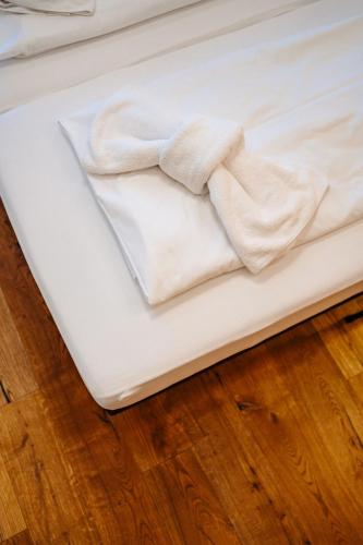 Uma cama ou camas num quarto em Hotel Rupertihof