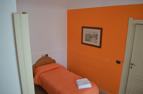 Postel nebo postele na pokoji v ubytování Paradiso della Zagara