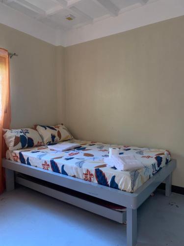 a bed in a room with a bed sidx sidx sidx at G-Bay Farm Village in Malolos