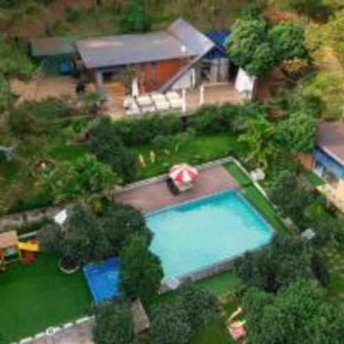 an overhead view of a swimming pool and a house at SH Homestay - Venuestay in Sóc Sơn
