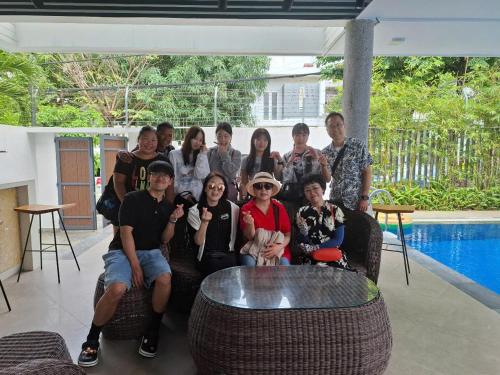 a group of people are posing for a picture at Charming Luxury Beach Villa Da Nang in Da Nang