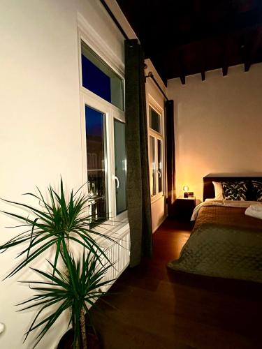 a bedroom with a bed and a large window at Luxury Suites Princess by Rikas Hotels in Antwerp