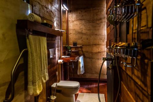 a bathroom with a white toilet in a room at Droombos Boutique Hotel in Windhoek