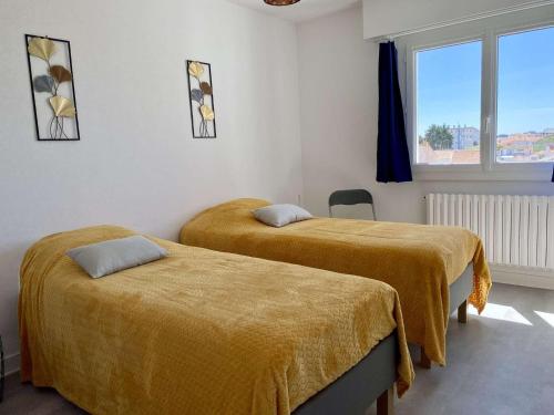 En eller flere senge i et værelse på Panorama Saint Gilles Croix de Vie