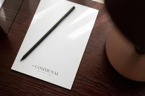 a paper with a pencil on top of a table at Communal Hotel Kutaisi in Kutaisi