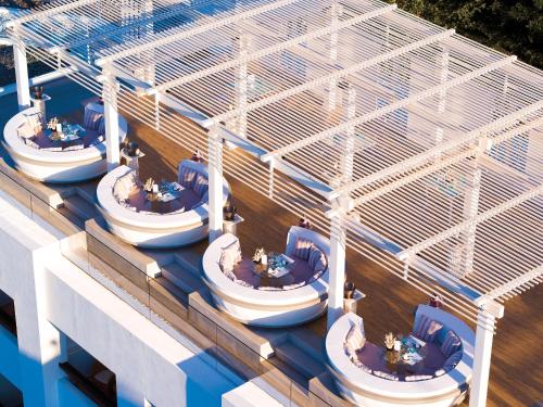an overhead view of a building with a group of boats at Grecotel Creta Palace in Rethymno Town